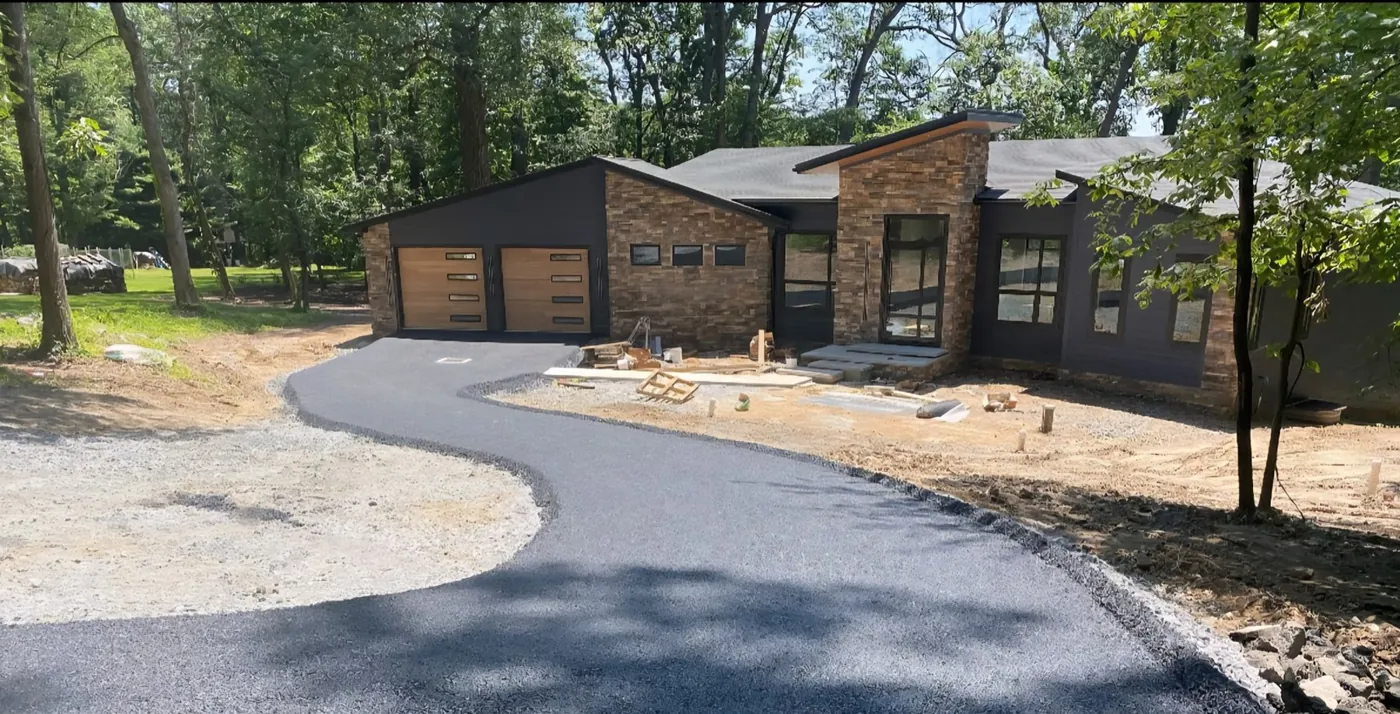 Fresh asphalt driveway at a modern home