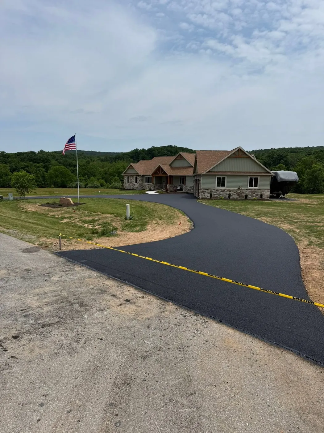 New asphalt driveway at a newly built house